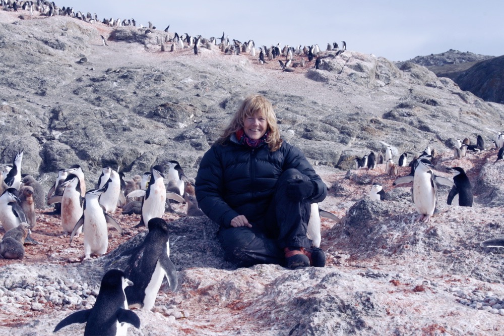Shelley Gill in Antarctica with penguins