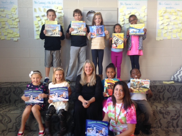 Shelley Gill with elementary school kids and their signed books
